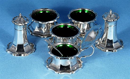 An Art Nouveau George V silver six piece cruet set, pepper height 82mm, weight 10.1oz/317grms.